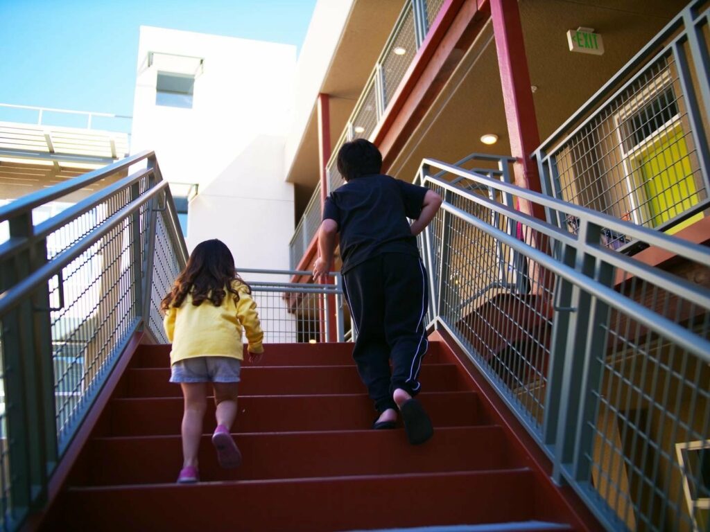 Kids running up the stairs