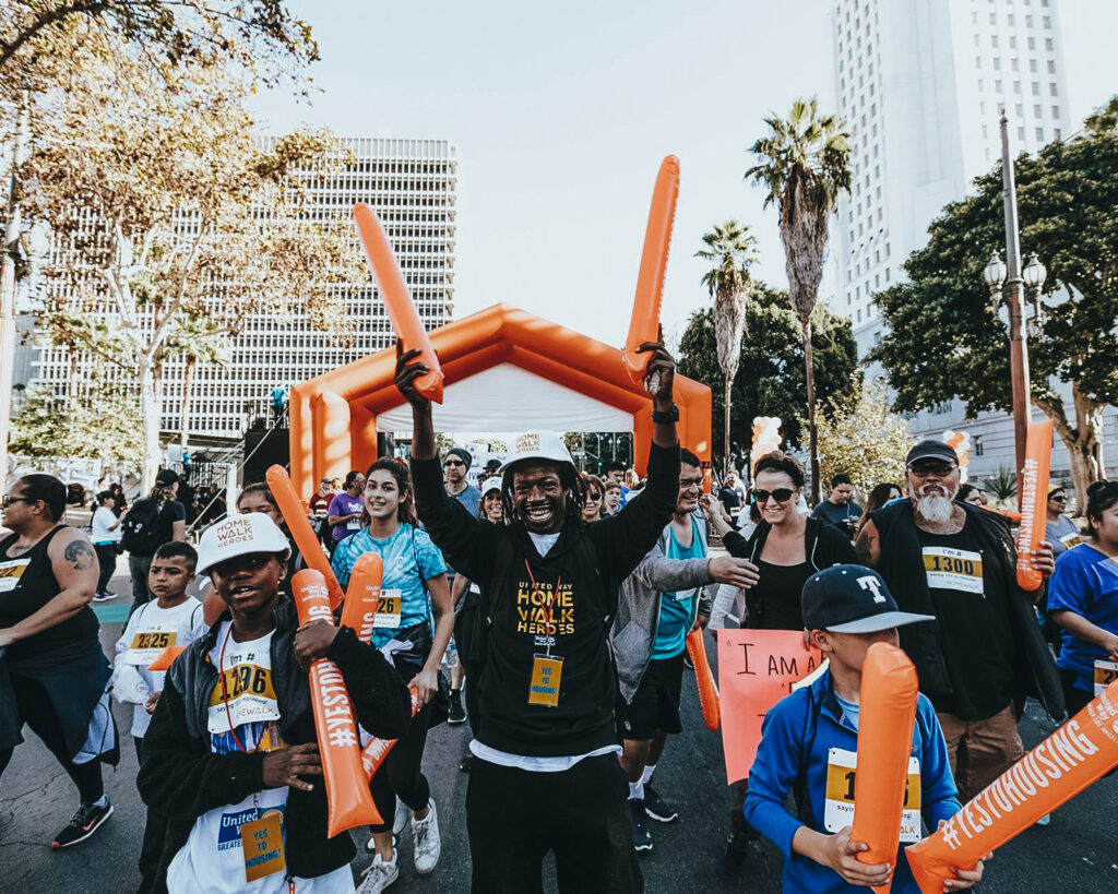 Crowd of happy people at a United Way event.