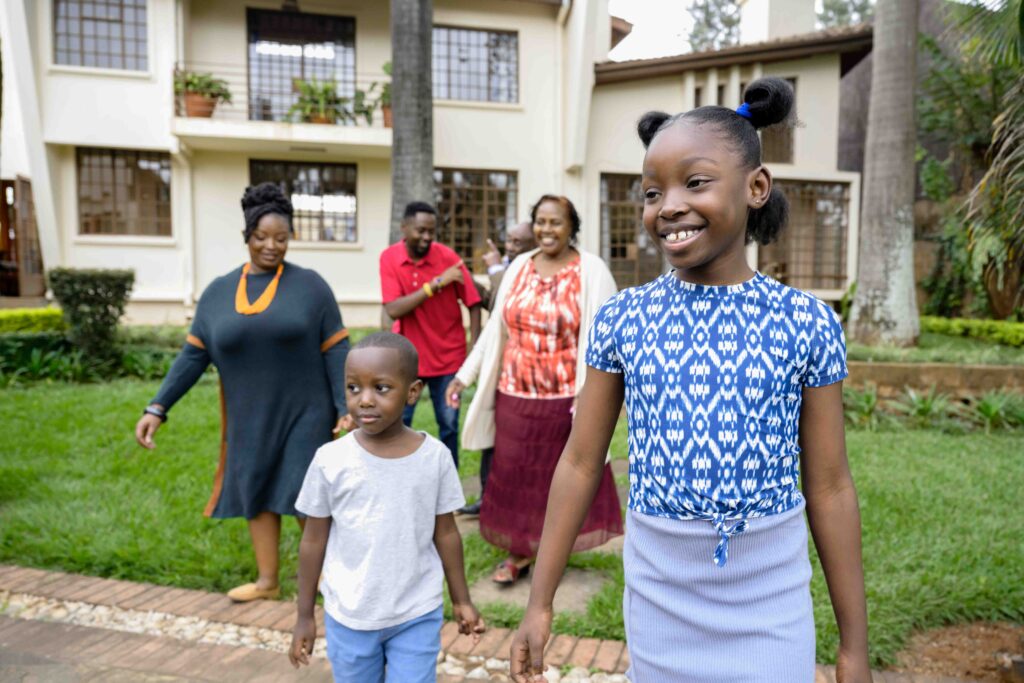 family in front of apartment building