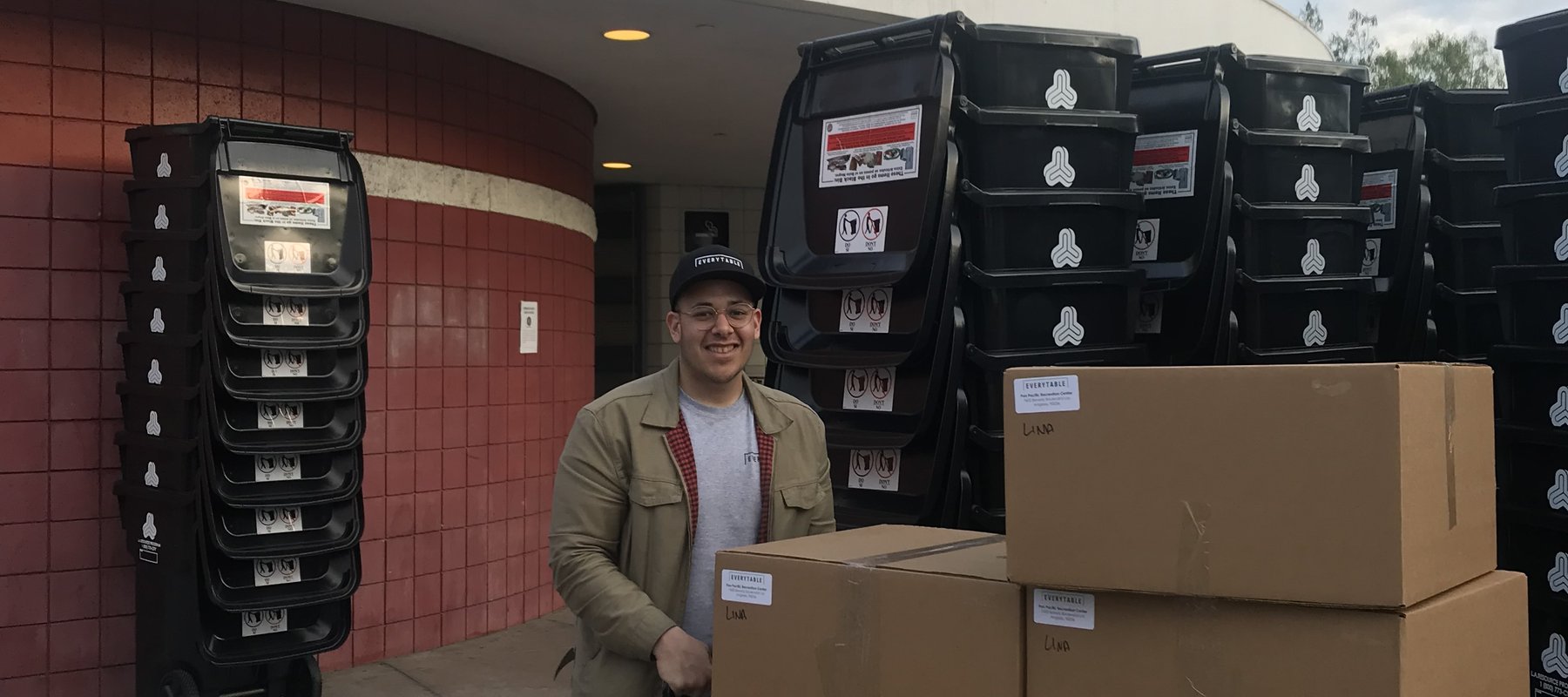 Man by a stack of boxes