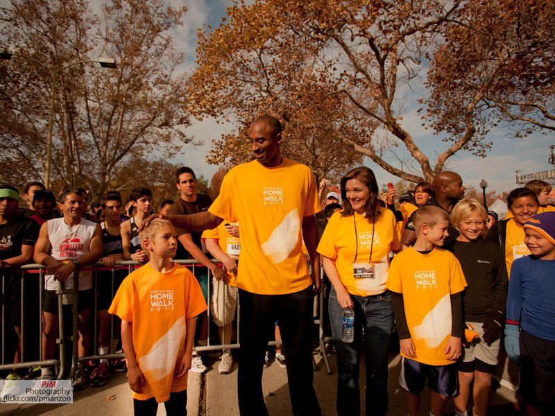 Kobe Bryant walking with Elise and a group of kids