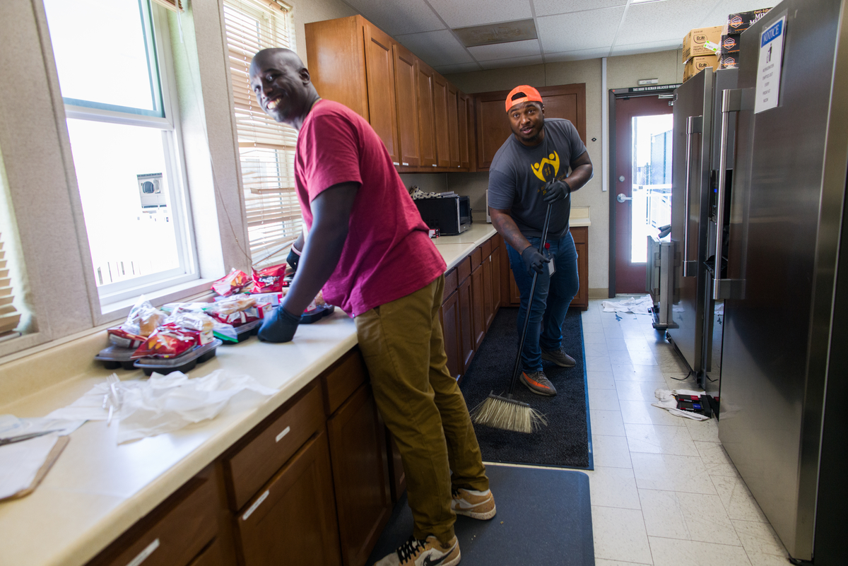two black men working in a kitchen