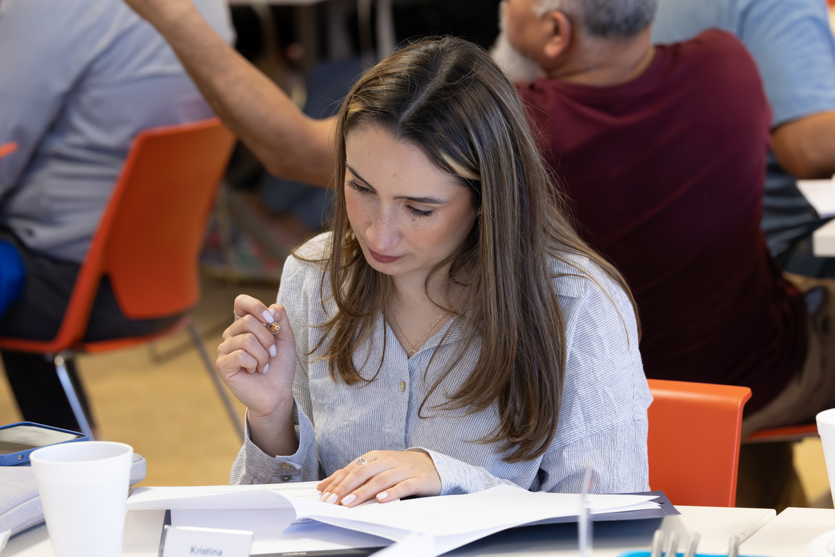 young woman writing in a notebook