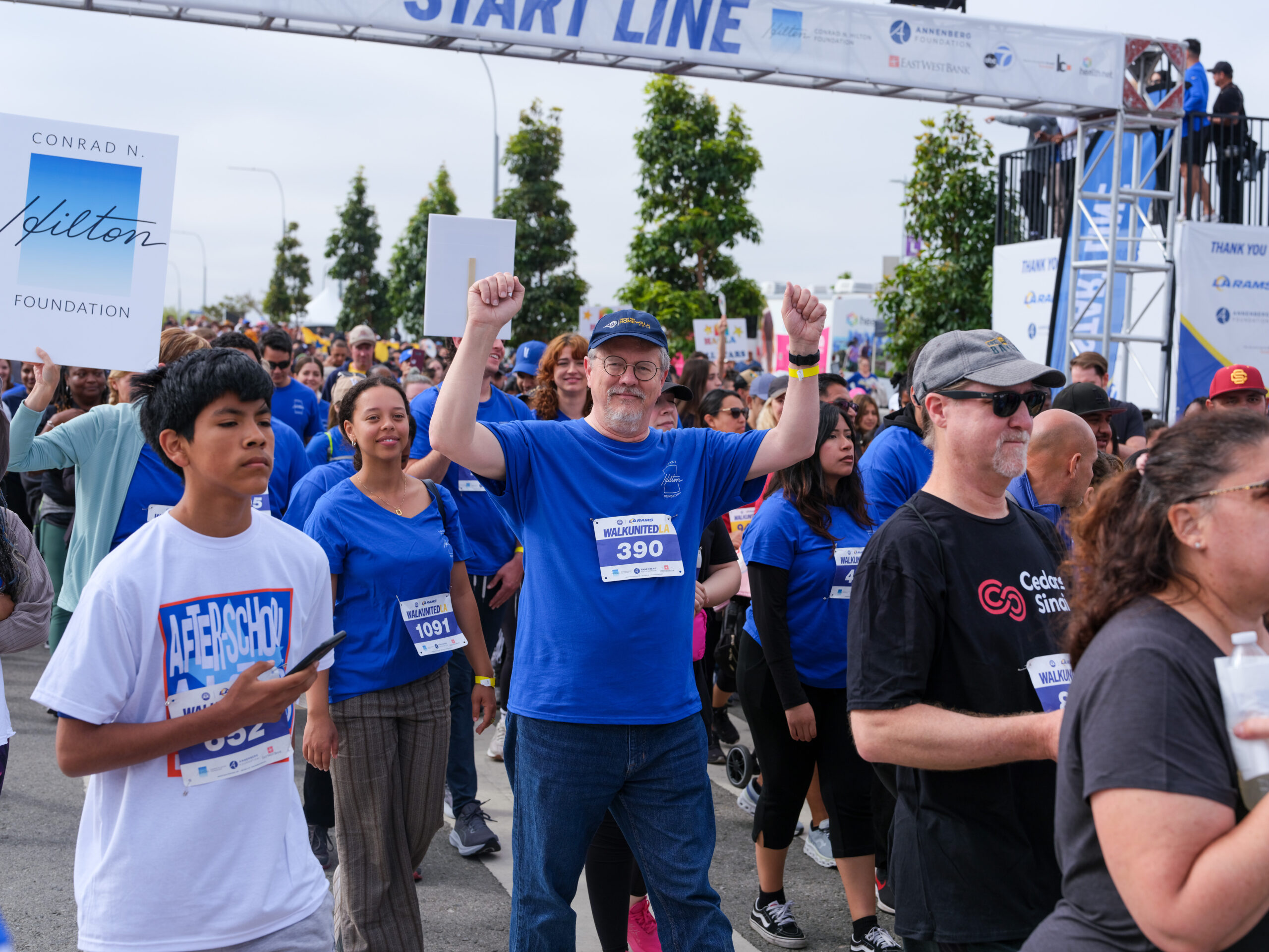 man pumping fist at starting line