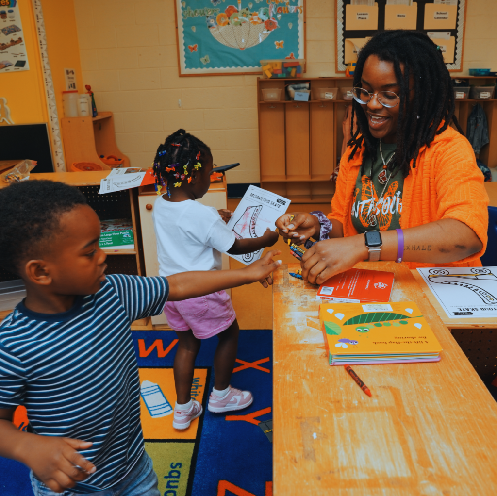 teacher helping young student
